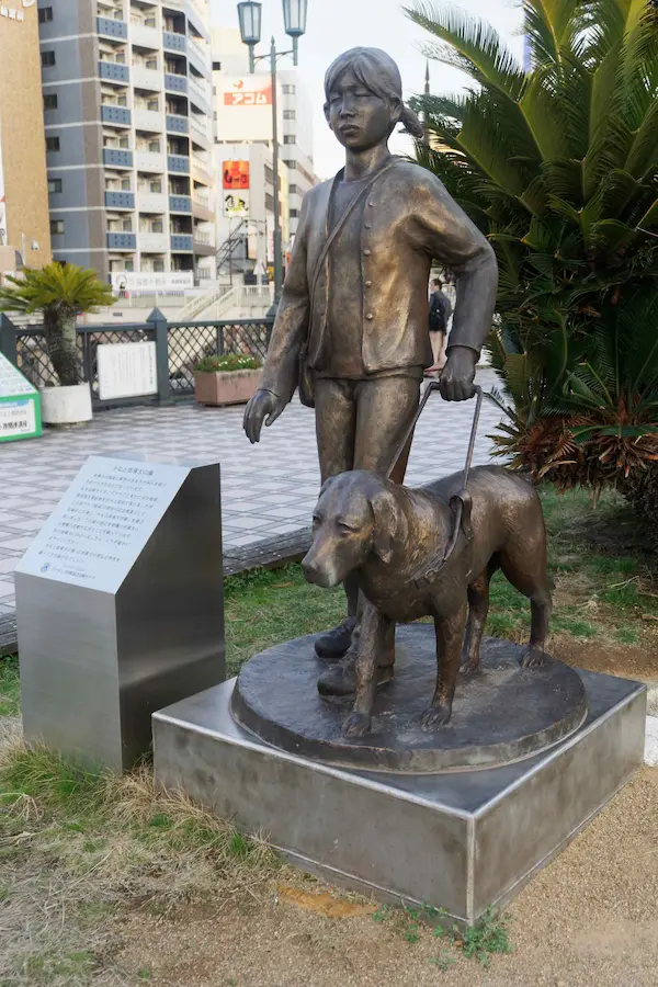 Boy and dog statue